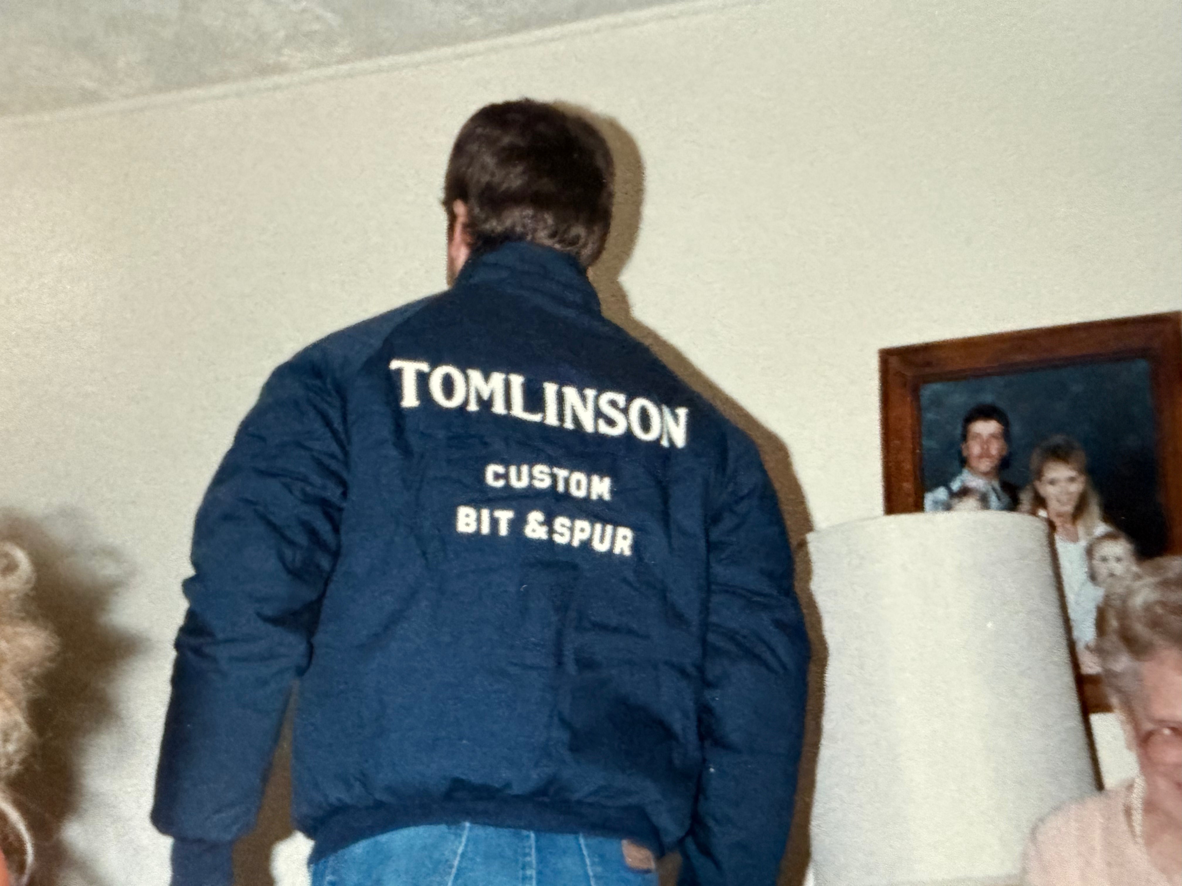 Cowboy wearing a Tomlinson Custom Bit & Spur Jacket.